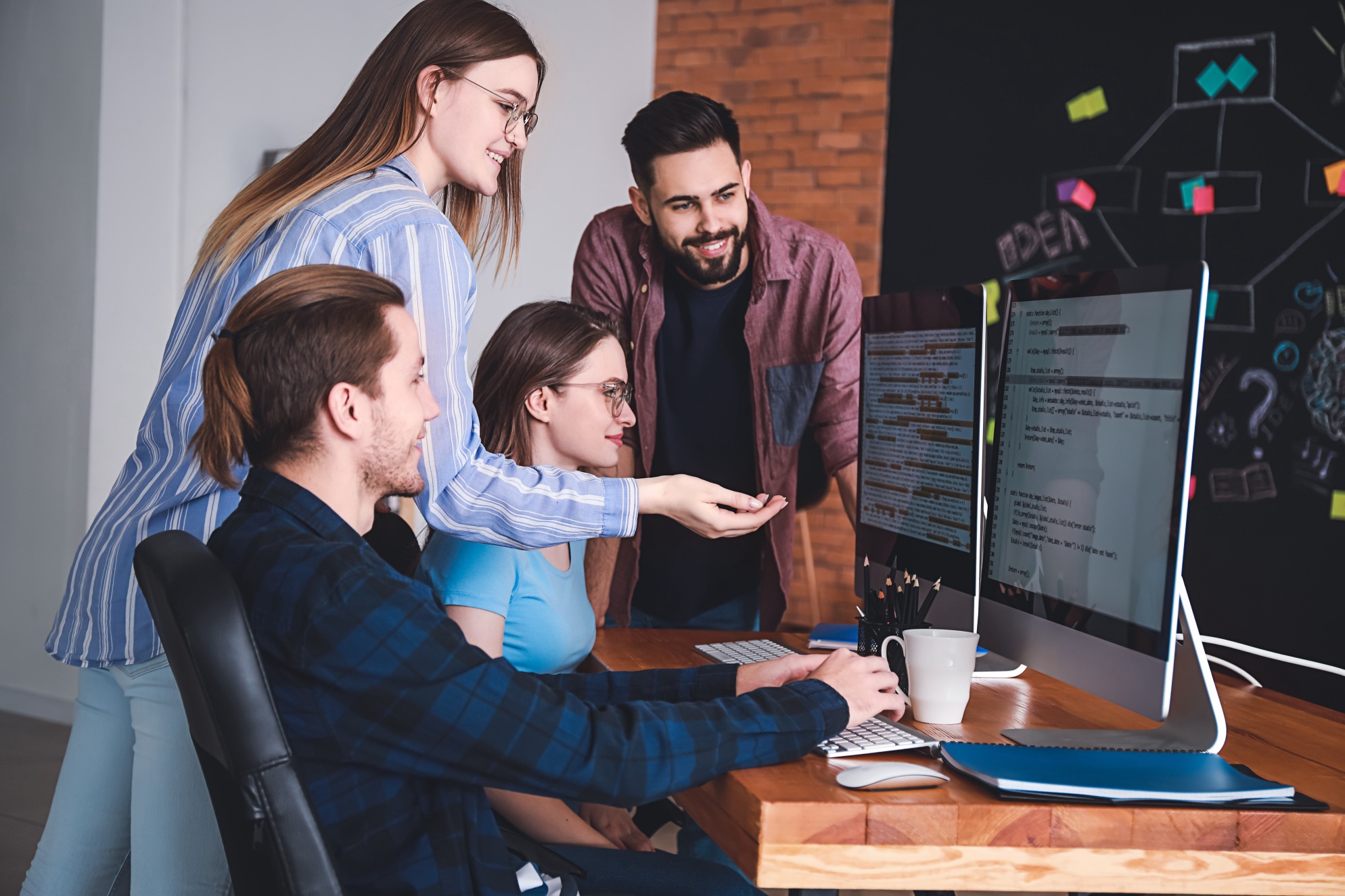 Team of programmers working in office